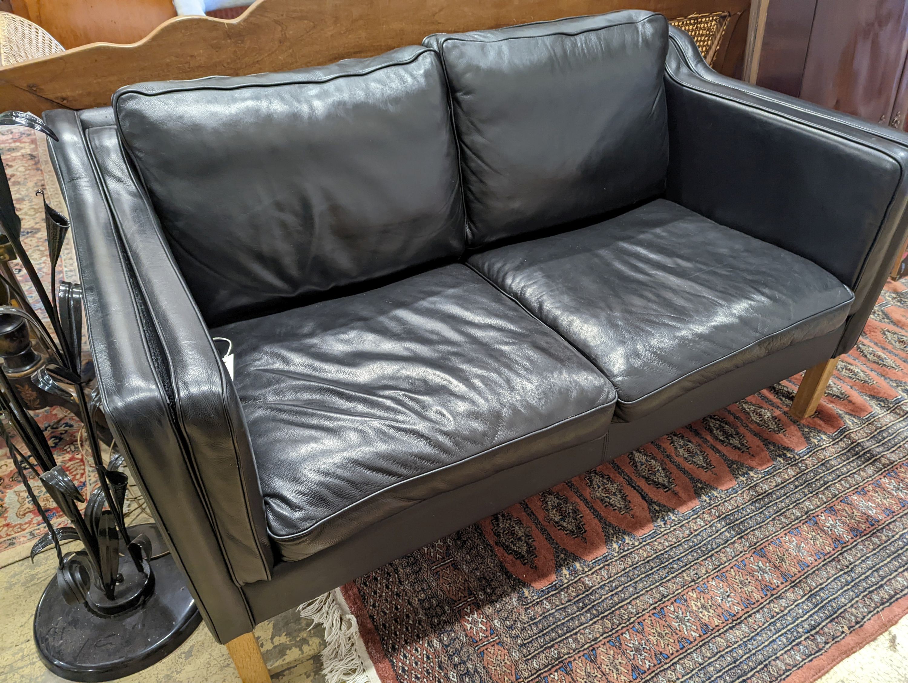 A Danish black leather two seater sofa in style of Borge mogensen, length 142cm, depth 83cm, height 80cm